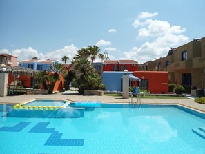 Seasonal outdoor pool, pool umbrellas, pool loungers