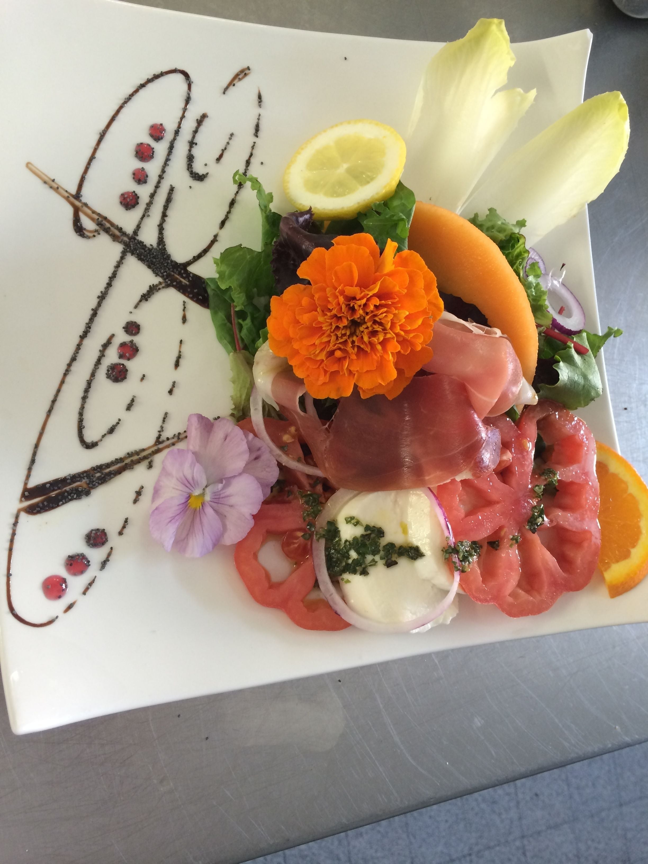 A plate of food with various ingredients and garnishes.
