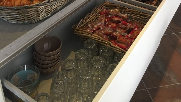 A buffet with various food items, including pastries, fruits, and condiments. - Auberge Les Galets Hotel Restaurant (Peyruis)