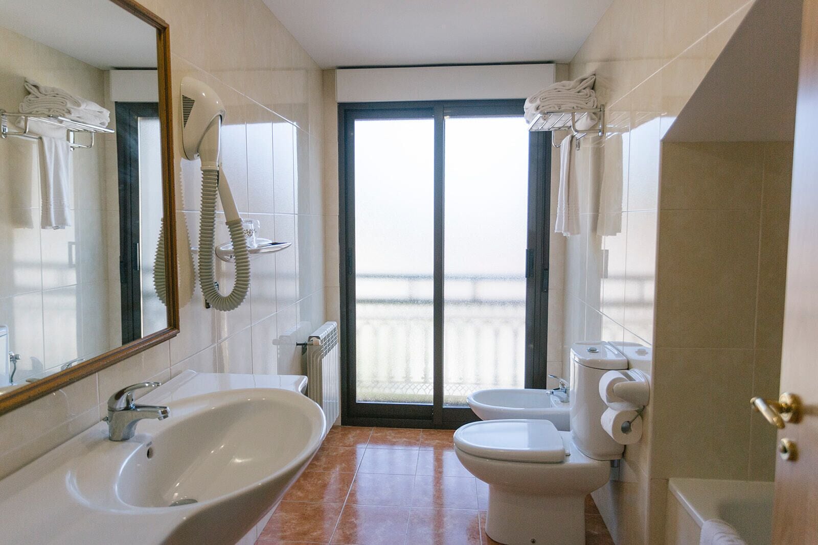 quadruple room | bathroom | free toiletries, hair dryer, bidet, towels