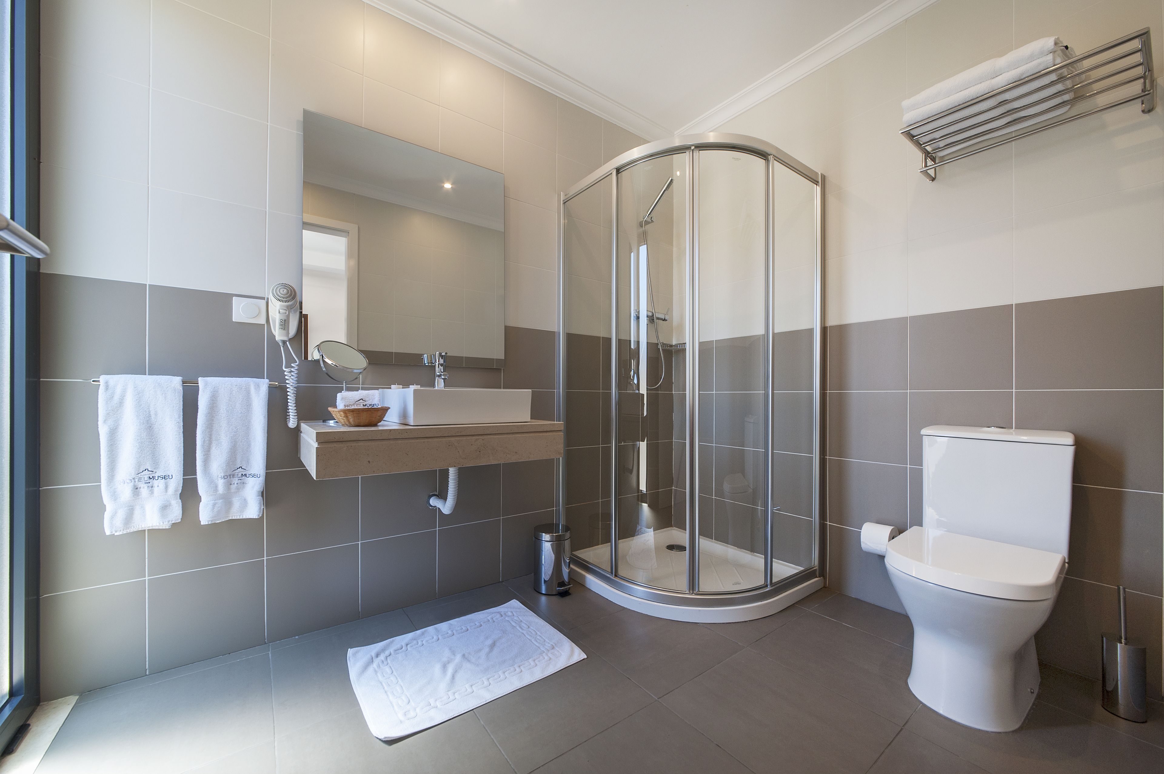 junior suite | bathroom | rainfall showerhead, hair dryer, bidet, towels