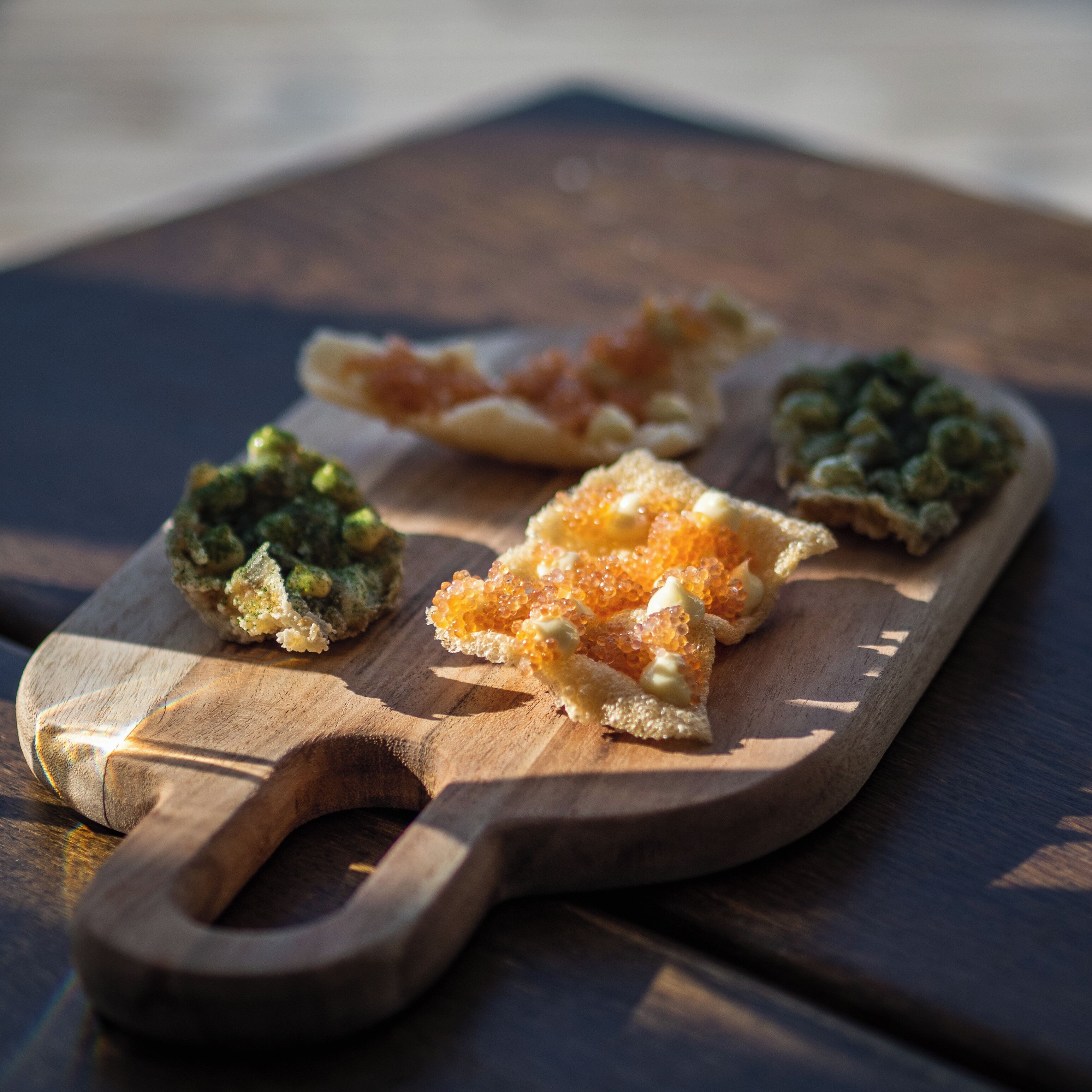 A wooden board with various food items.
