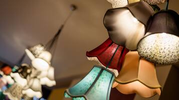 A variety of hanging lamps with different shapes and patterns.