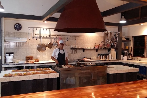 Breakfast, lunch, dinner served; Fusion cuisine, garden views