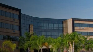 A modern hotel building with multiple floors, large windows, and a sign indicating it is a hotel. - Eurobuilding Express Barinas (Barinas)