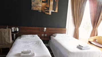 Pillow-top beds, desk, free WiFi, bed sheets