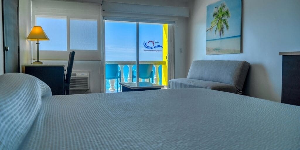 Comfort Room, Ocean View | Laptop workspace, blackout drapes, iron/ironing board, free WiFi