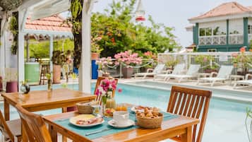 Breakfast, lunch, dinner served; local cuisine