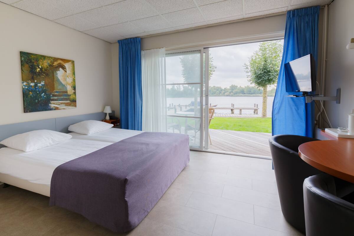 classic twin room, lake view | 1 bedroom, desk, blackout curtains, cots/infant beds