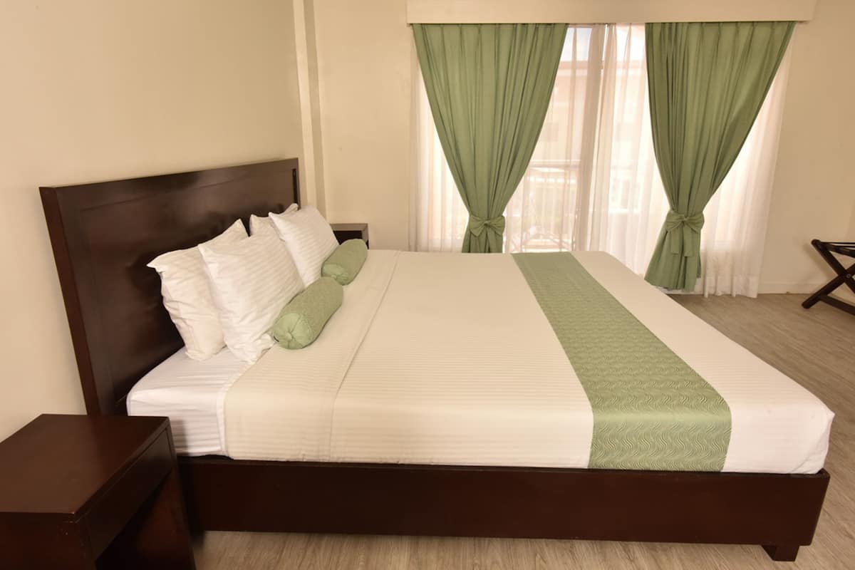 Deluxe Room, 1 King Bed | In-room safe, iron/ironing board, rollaway beds, free WiFi