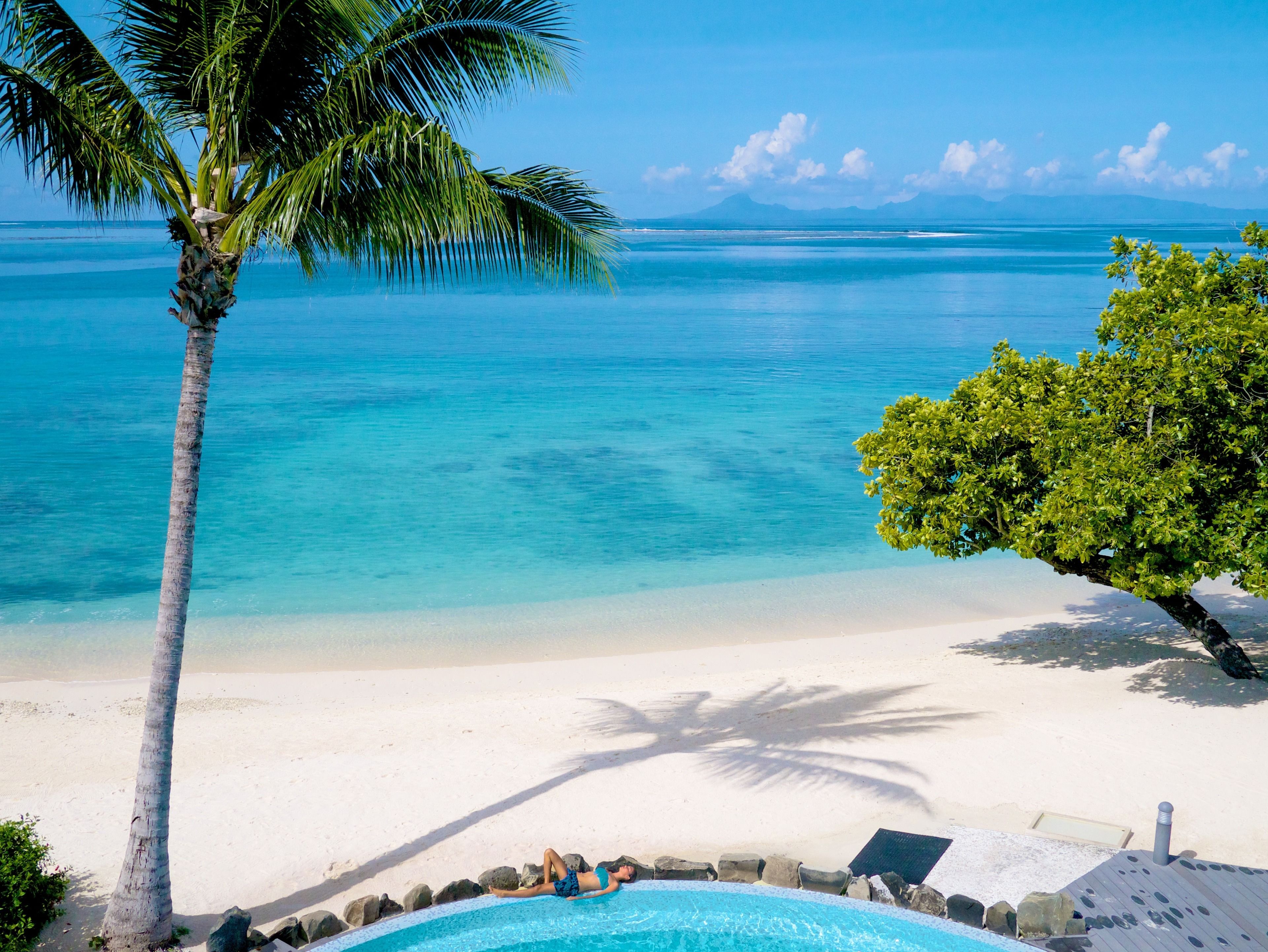 On the beach, sun loungers, beach towels, rowing