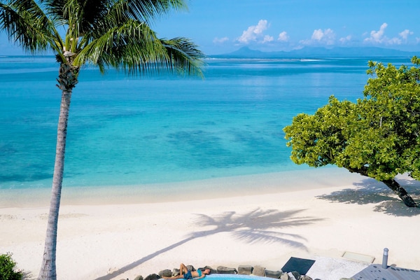 On the beach, sun loungers, beach towels, rowing