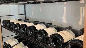 A wine rack with multiple bottles of wine, each with labels visible.