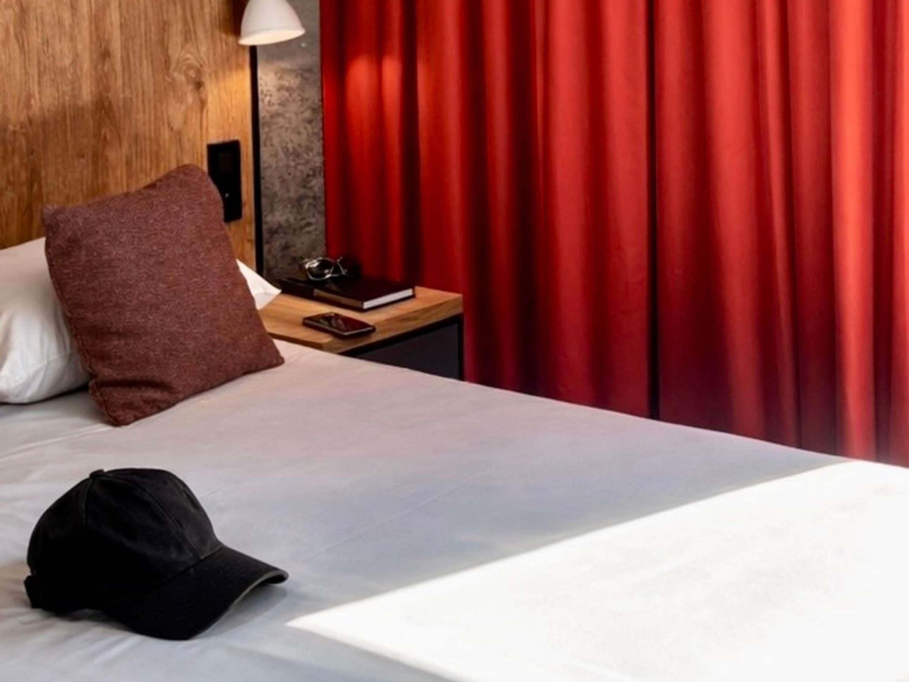 Premium bedding, desk, laptop workspace, blackout drapes