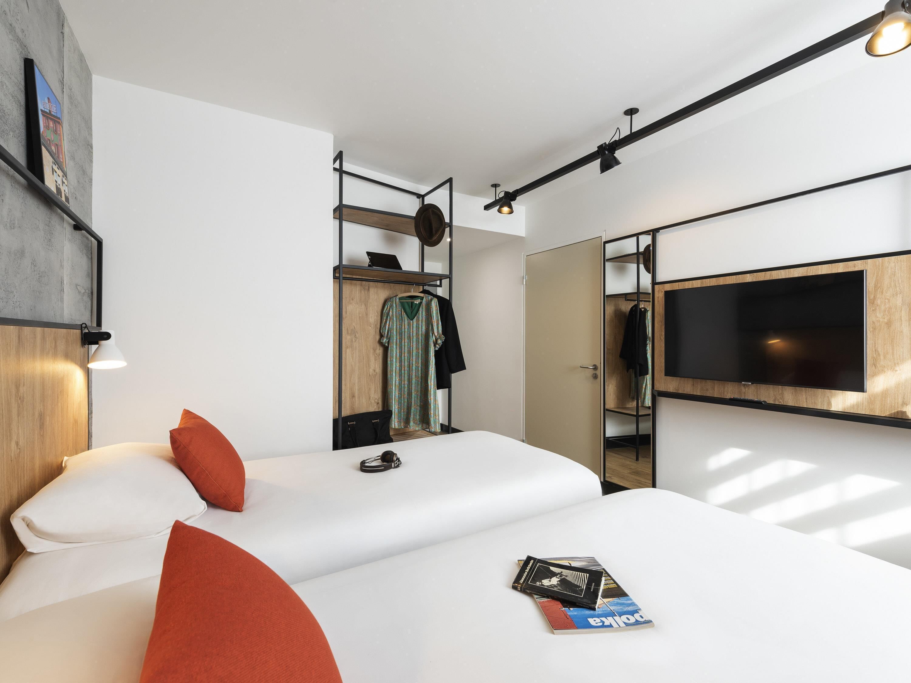 Premium bedding, desk, laptop workspace, blackout drapes