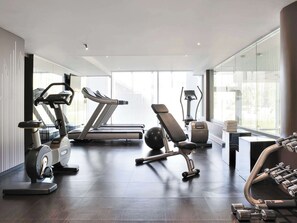 Work out in style with a variety of equipment, including a stationary bike, elliptical, treadmill, and weight bench.