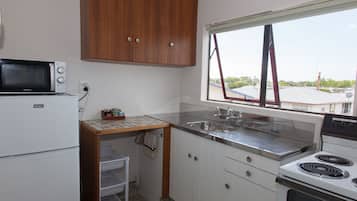 2 Bedroom Unit | Private kitchen | Fridge, microwave, stovetop, cookware/dishes/utensils