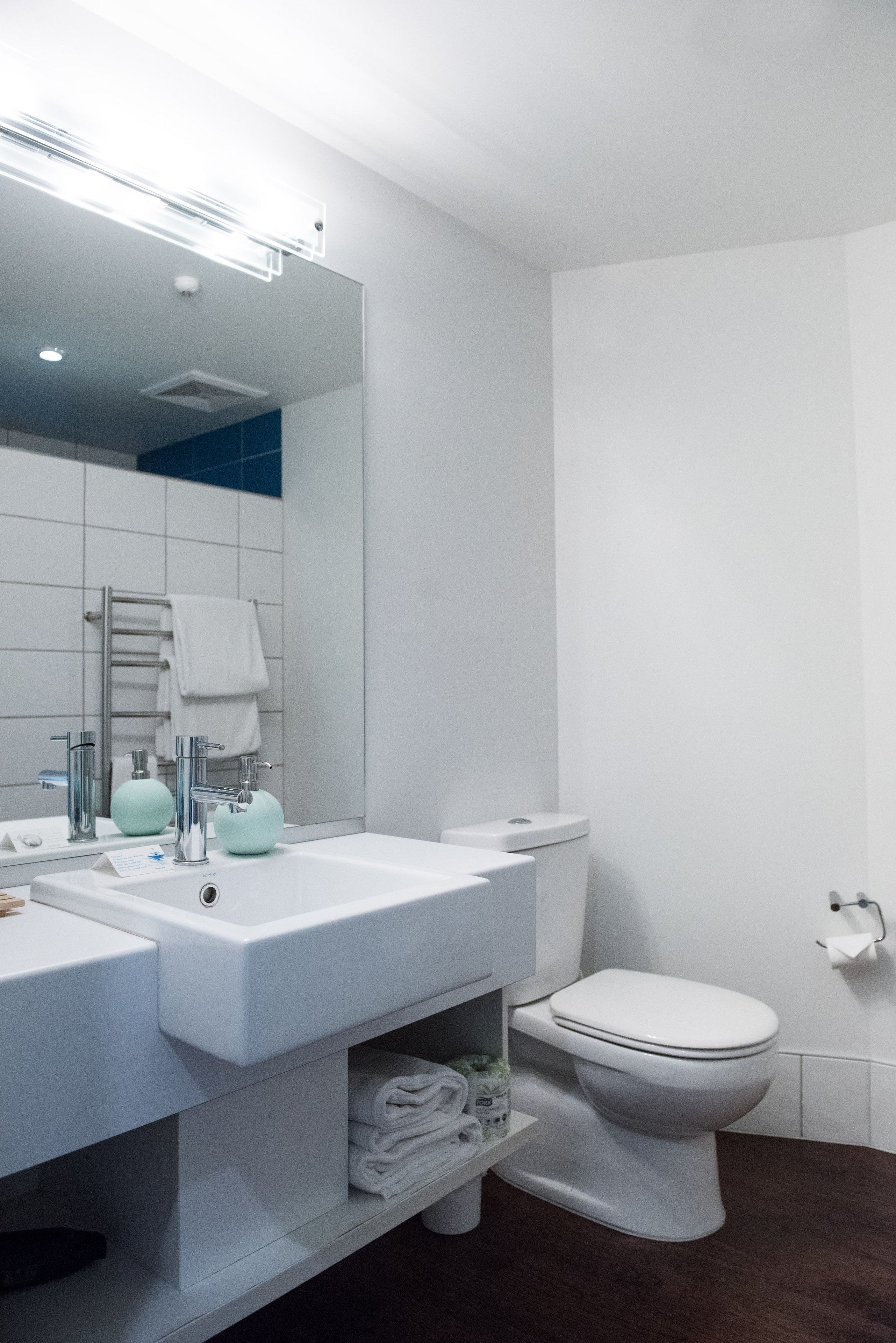 shower, rainfall showerhead, hair dryer, towels