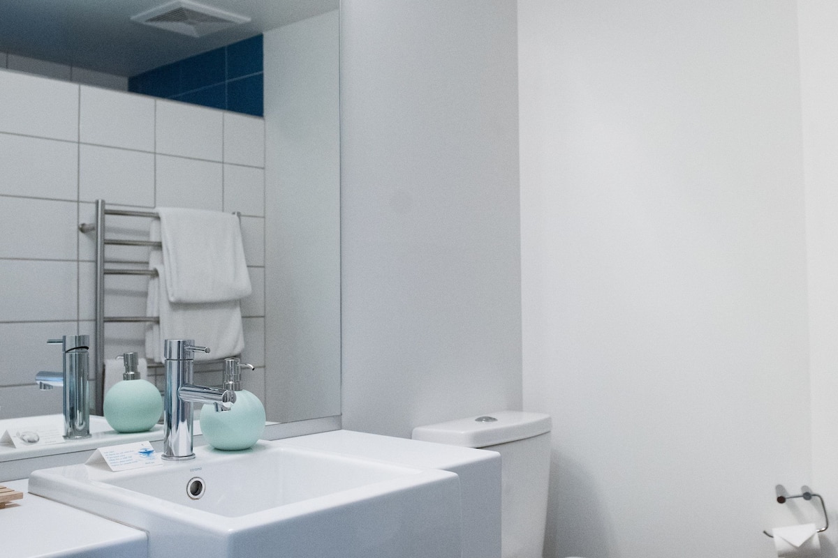 shower, rainfall showerhead, hair dryer, towels