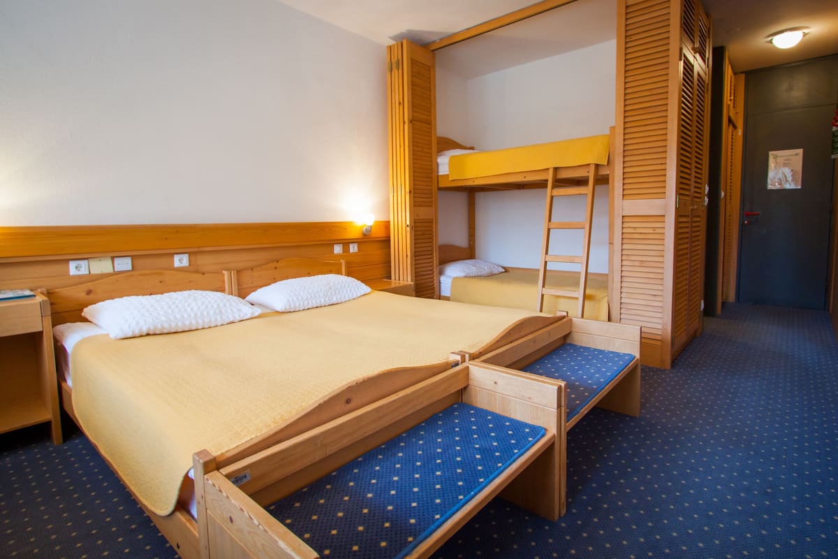 family room | in-room safe, desk, blackout curtains, iron/ironing board