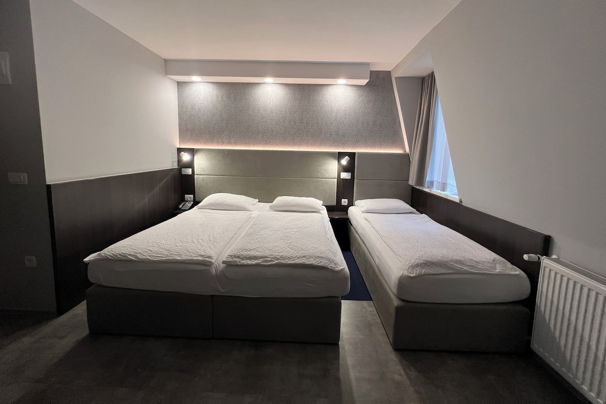 Triple Room | 1 bedroom, in-room safe, desk, blackout drapes