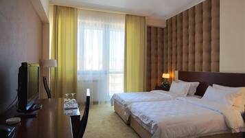 Down comforters, memory foam beds, minibar, in-room safe