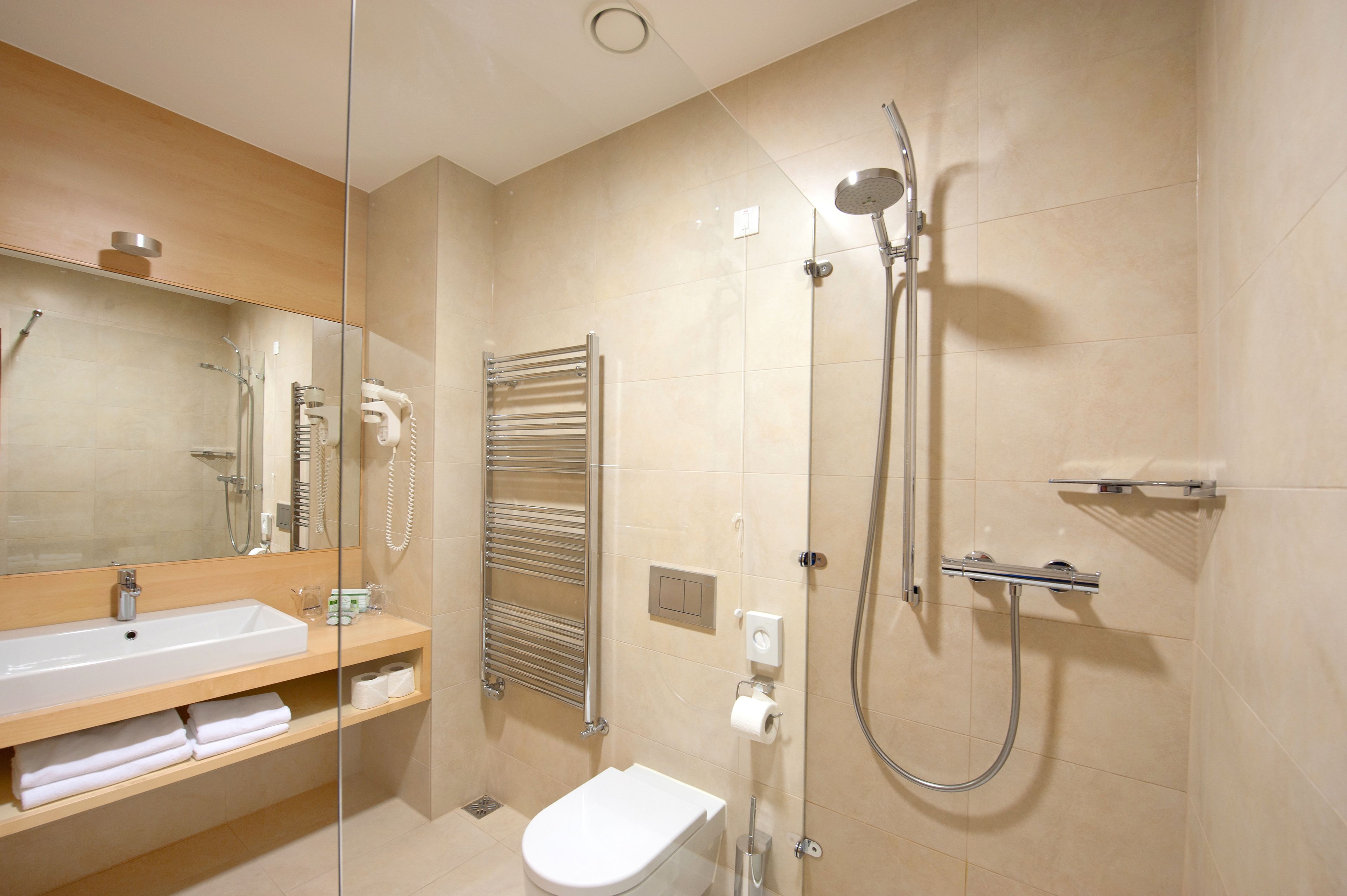 rainfall showerhead, designer toiletries, hair dryer, bathrobes