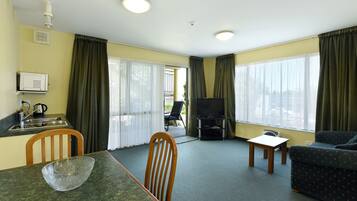 Standard Suite, 1 Bedroom | Living room | 42-inch Smart TV with digital channels