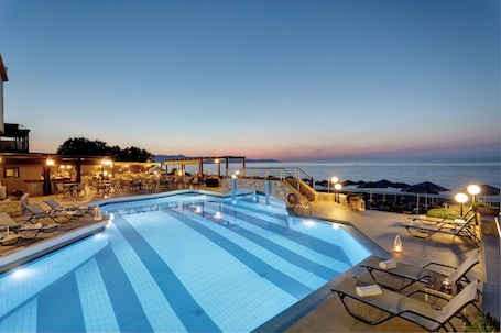 2 outdoor pools, open 9:00 AM to 7:00 PM, pool umbrellas, pool loungers. Indigo Mare Hotel Apartments