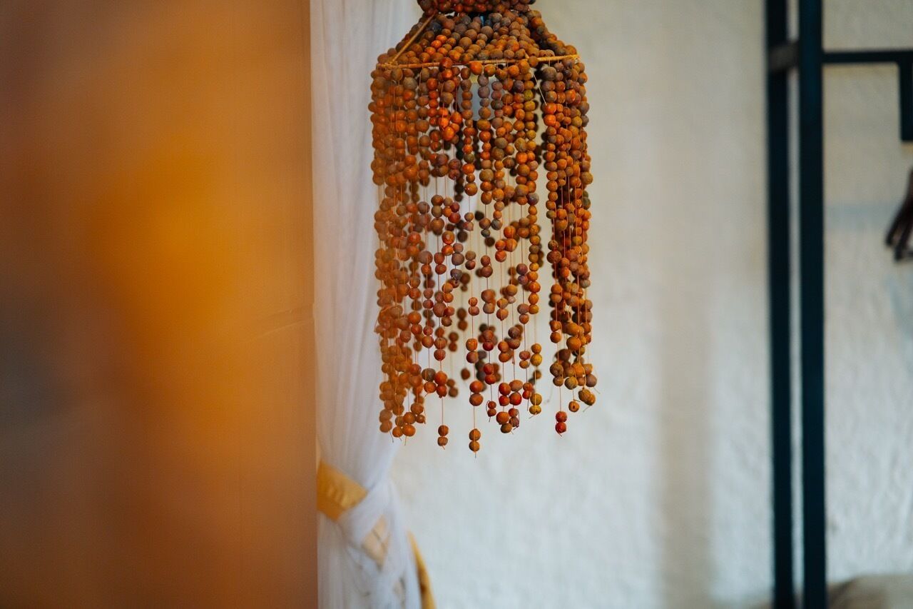 A hanging ornament made of beads.