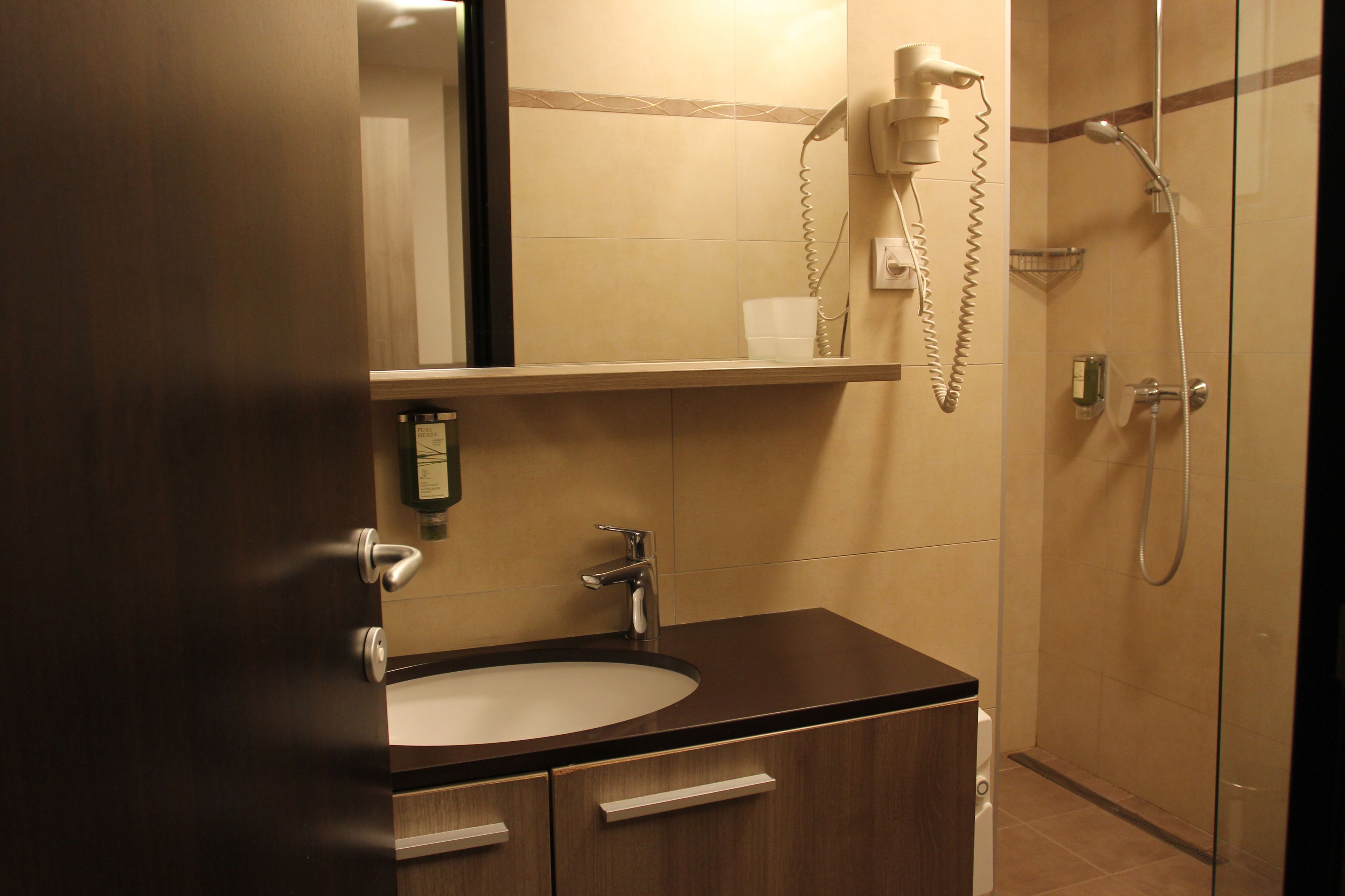 twin room, 2 single beds | bathroom | shower, rainfall showerhead, towels