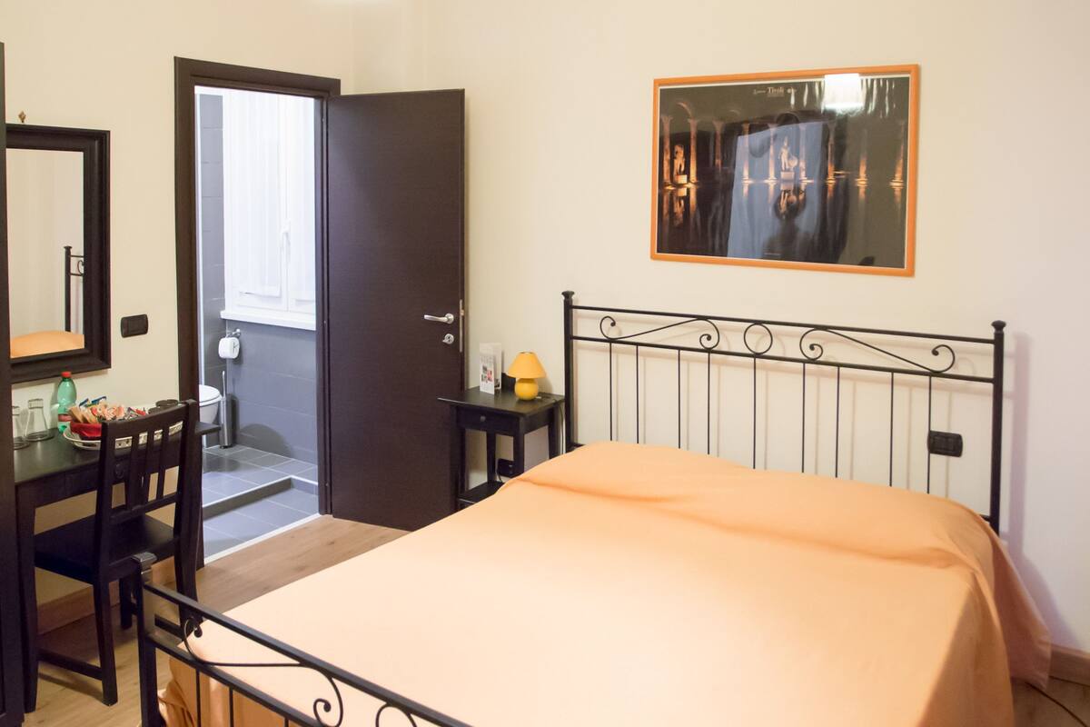 Premium bedding, memory-foam beds, desk, laptop workspace