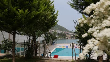 Seasonal outdoor pool, pool umbrellas, sun loungers