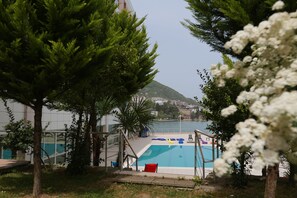 Seasonal outdoor pool, pool umbrellas, sun loungers