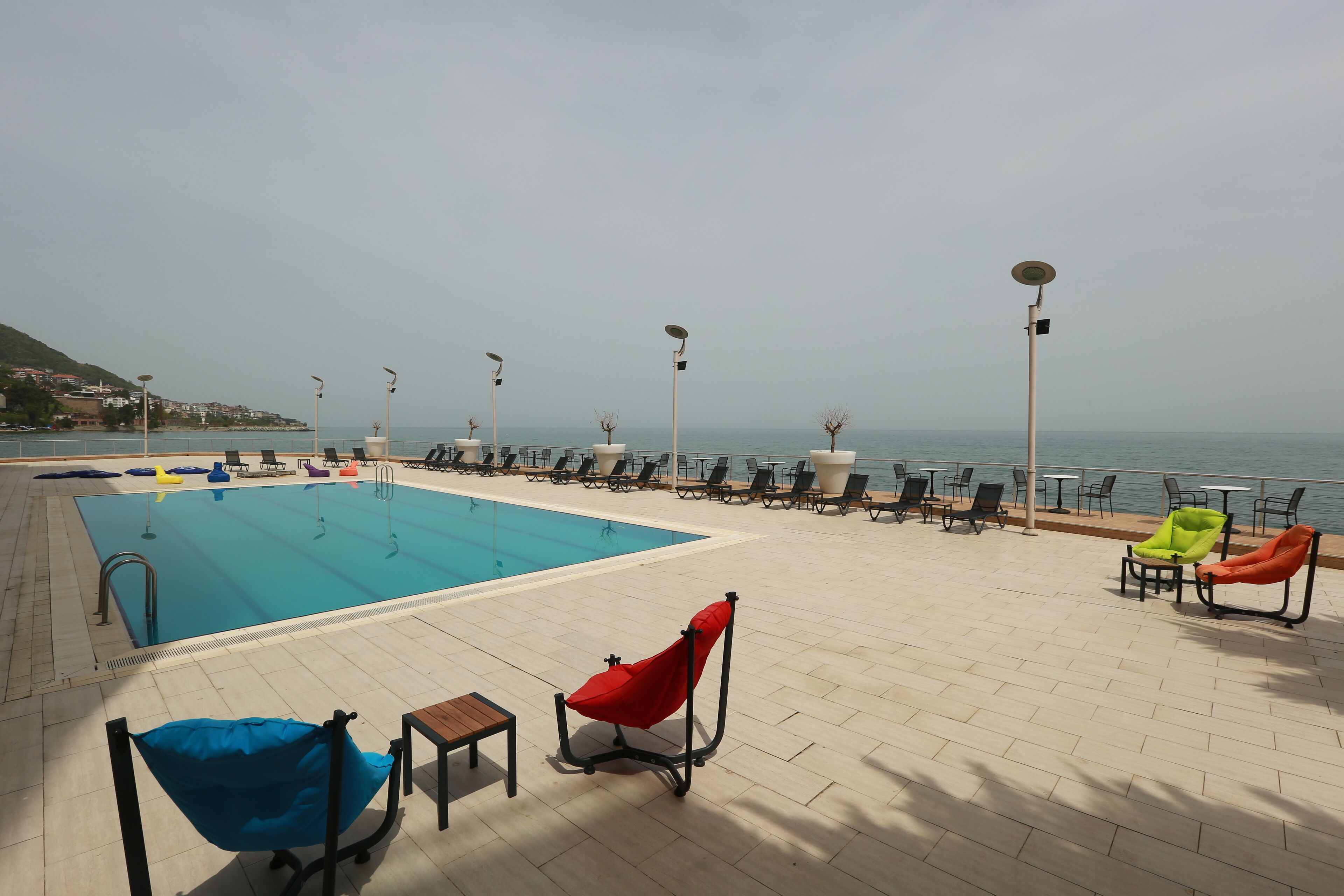 seasonal outdoor pool, pool umbrellas, pool loungers