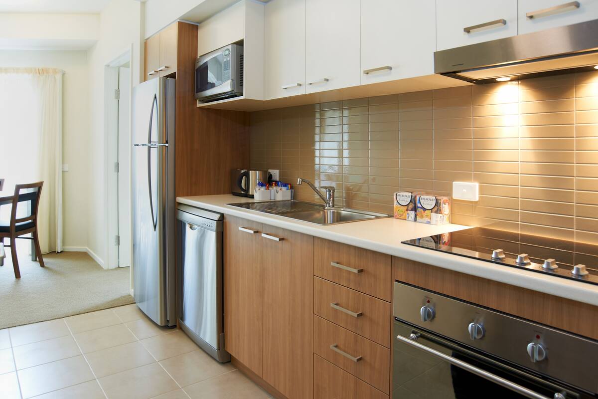 full-sized fridge, microwave, stovetop, coffee/tea maker