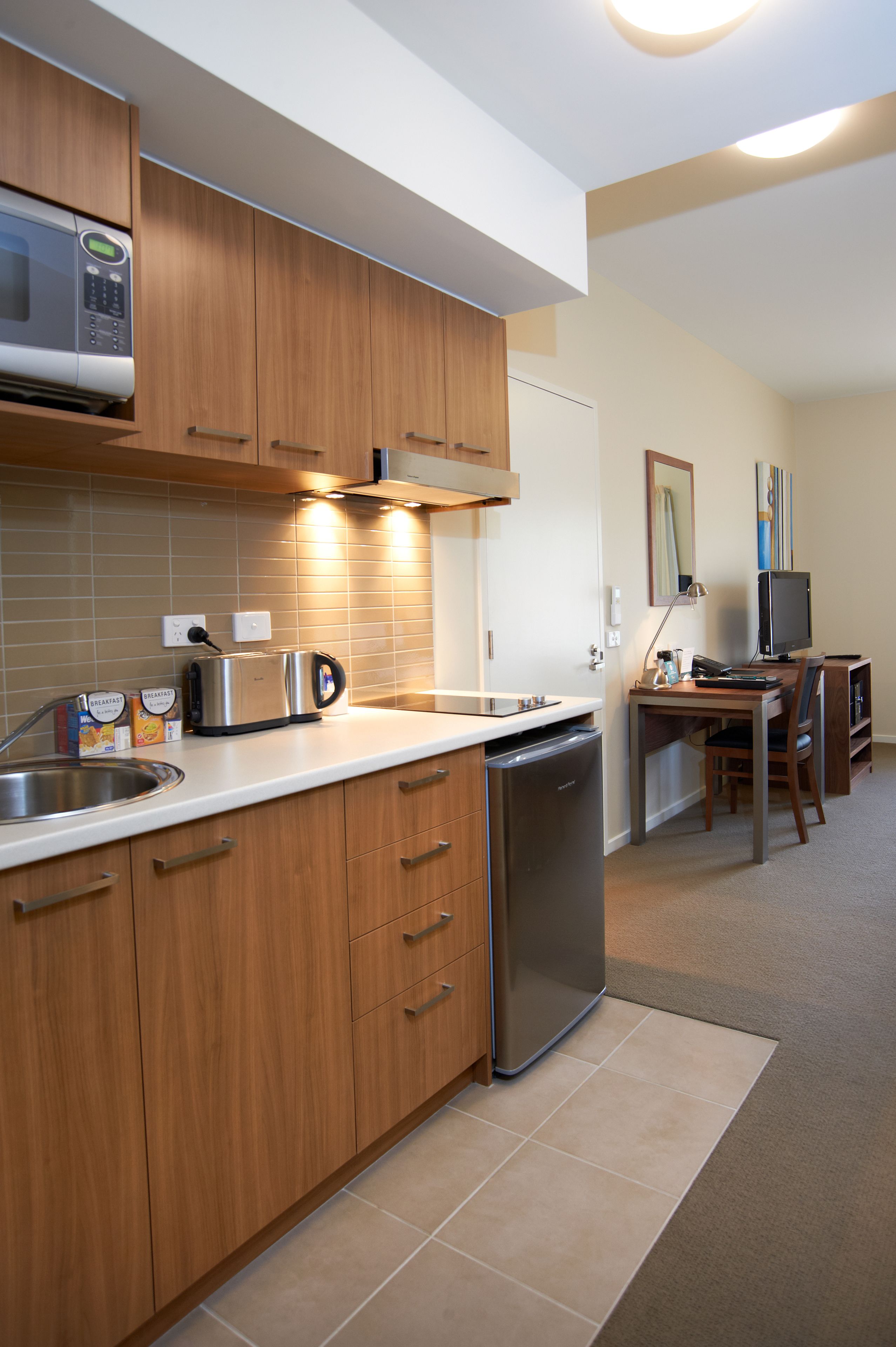 full-sized fridge, microwave, stovetop, coffee/tea maker