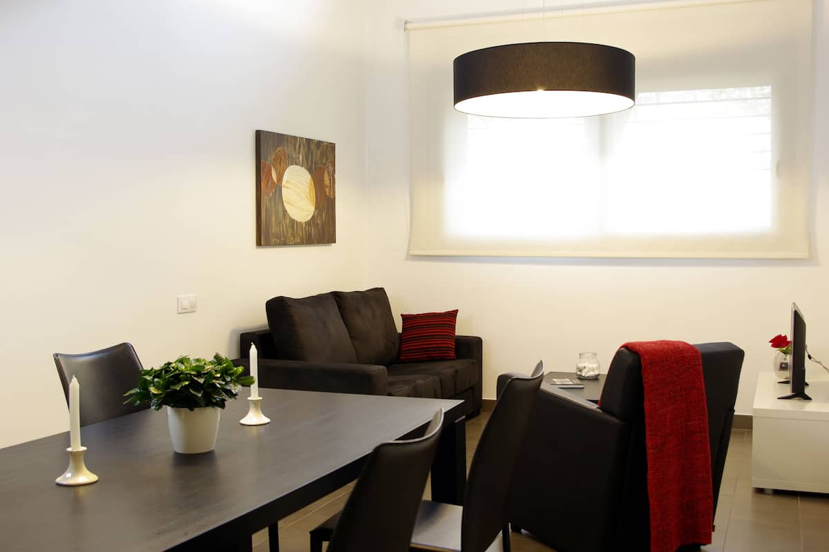 Duplex Family Apartment (2 adults + 2 children) | Living room | 32-inch LCD TV with satellite channels, TV