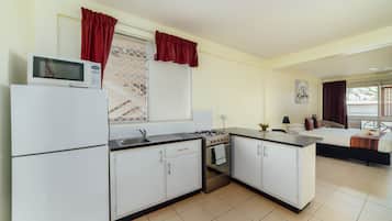 Estúdio executivo | Cozinha privada | Geladeira, micro-ondas, cooktop, cafeteira/chaleira
