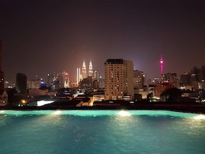 A nighttime cityscape with a prominent building featuring two towers and a lit tower in the distance. - WTC Hotel, Kuala Lumpur - Formerly Leo Palace Hotel Classic Wing (Kuala Lumpur)