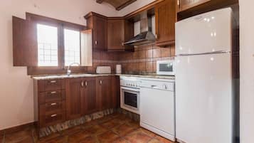 Comfort Apartment | Private kitchen | Full-size fridge, microwave, stovetop, dishwasher