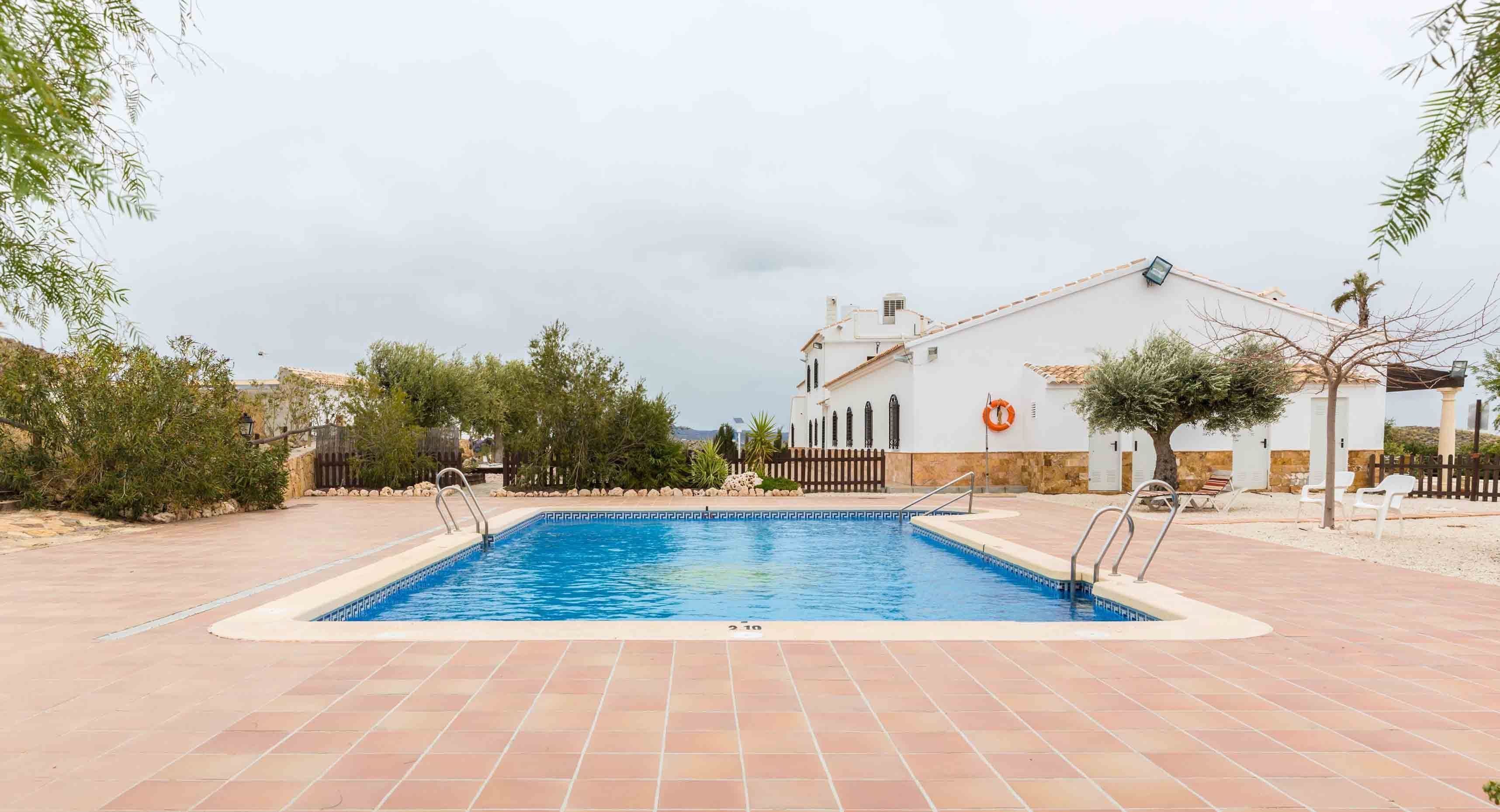 Seasonal outdoor pool, pool umbrellas, pool loungers