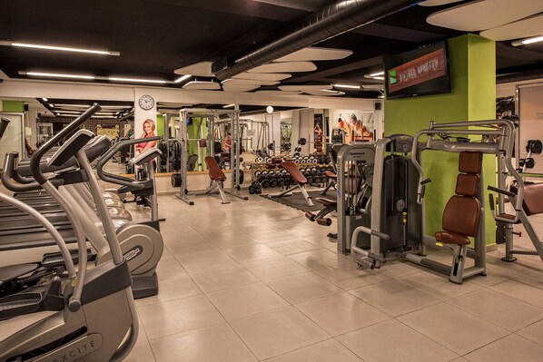 A gym with treadmills, weight machines, and dumbbells. - Nartel Hotel (Pristina)