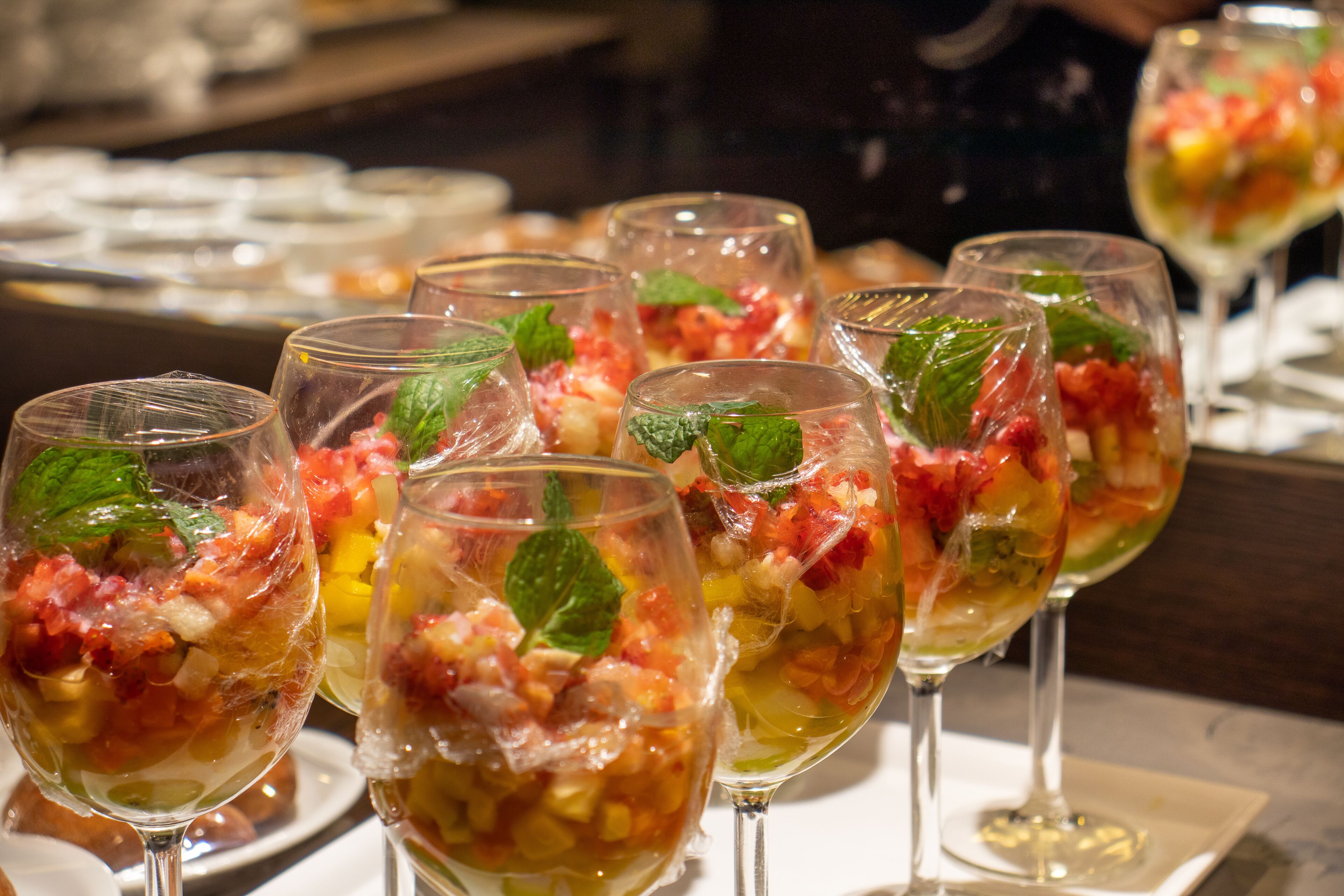 A buffet with various dishes and drinks.