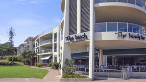 A multi-story building with balconies and a restaurant named "The Beach Bar". - The Beach Cabarita (Cabarita Beach)