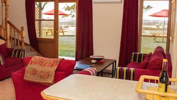 2 Bedroom Lodge | Living area | 35-inch plasma TV with digital channels, TV, fireplace