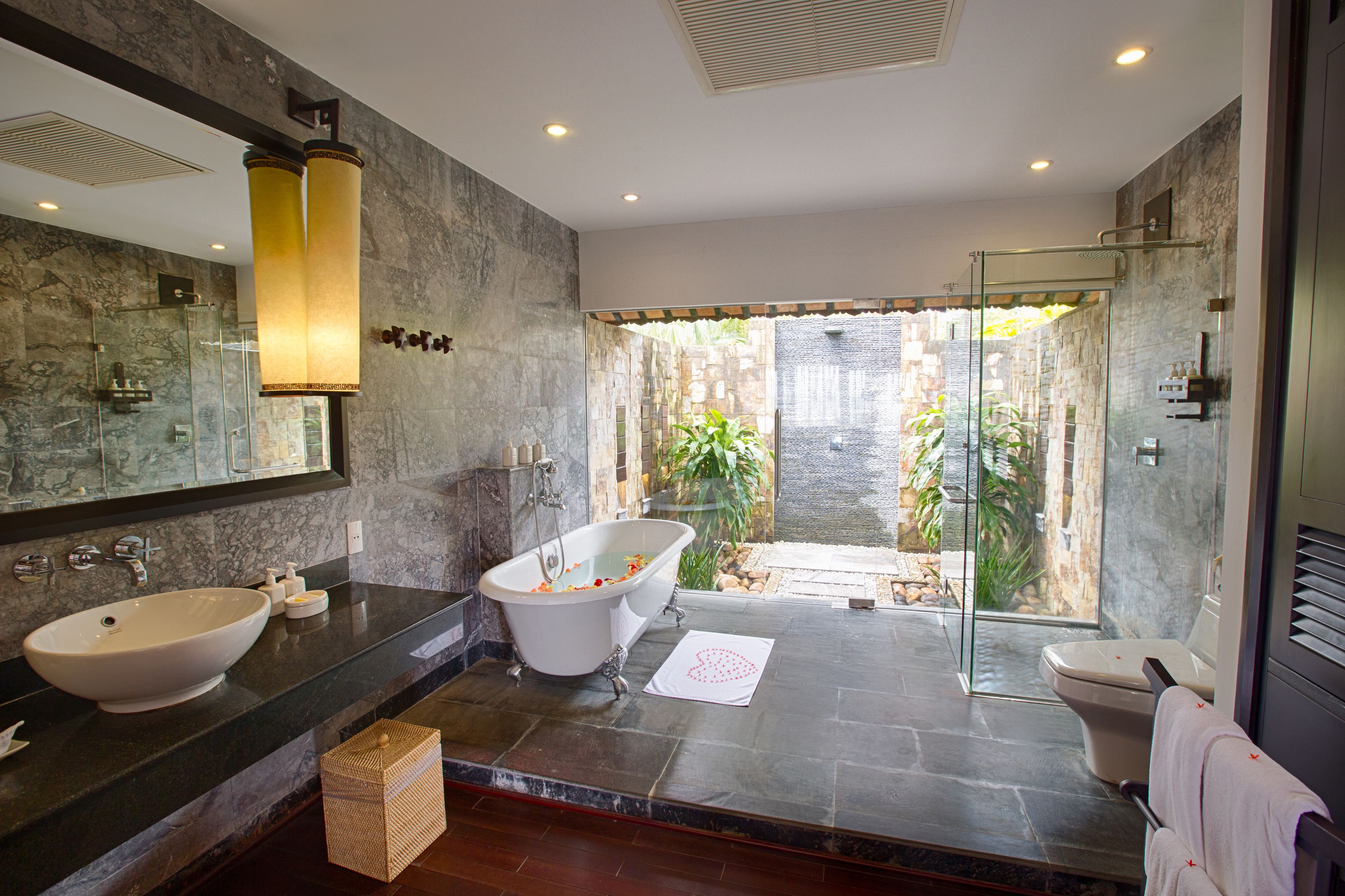 separate bathtub and shower, rainfall showerhead, designer toiletries