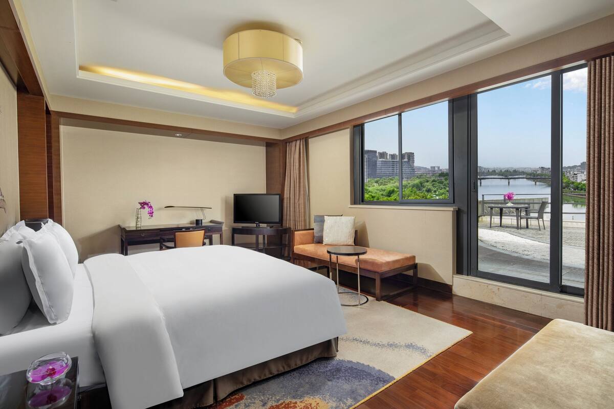 Suite, 1 Bedroom, River View | In-room safe, desk, laptop workspace, blackout curtains