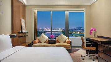 Premium Room, 1 King Bed, River View | In-room safe, desk, laptop workspace, blackout drapes