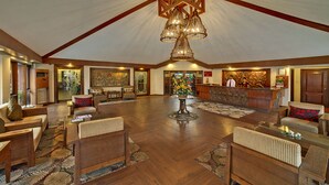 A spacious lobby with wooden flooring, a central chandelier, and a reception desk. - MAYFAIR Heritage, Puri (Puri)